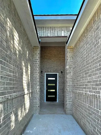 a view of an empty room and a window