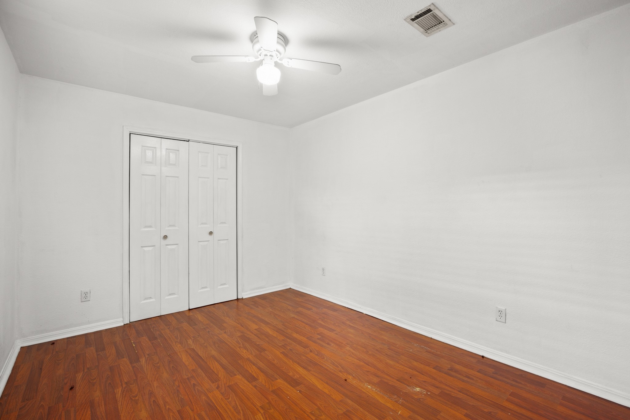 2610 East 3rd Street, Unit B Austin, TX 78702 - Photo 11 of 14 wooden floor in an empty room