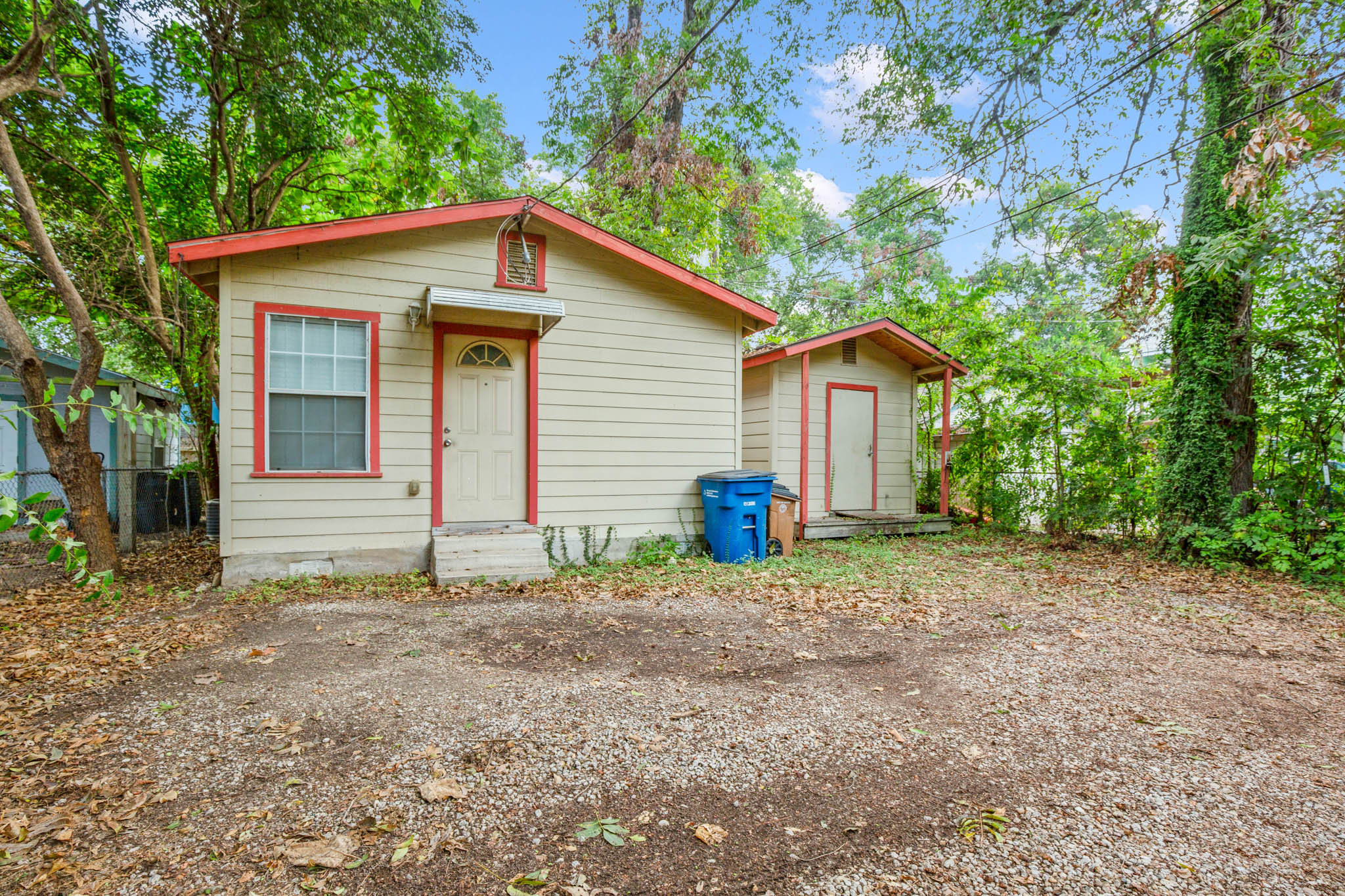 2610 East 3rd Street, Unit B Austin, TX 78702 - Photo 13 of 14 a view of a house with a yard and large tree