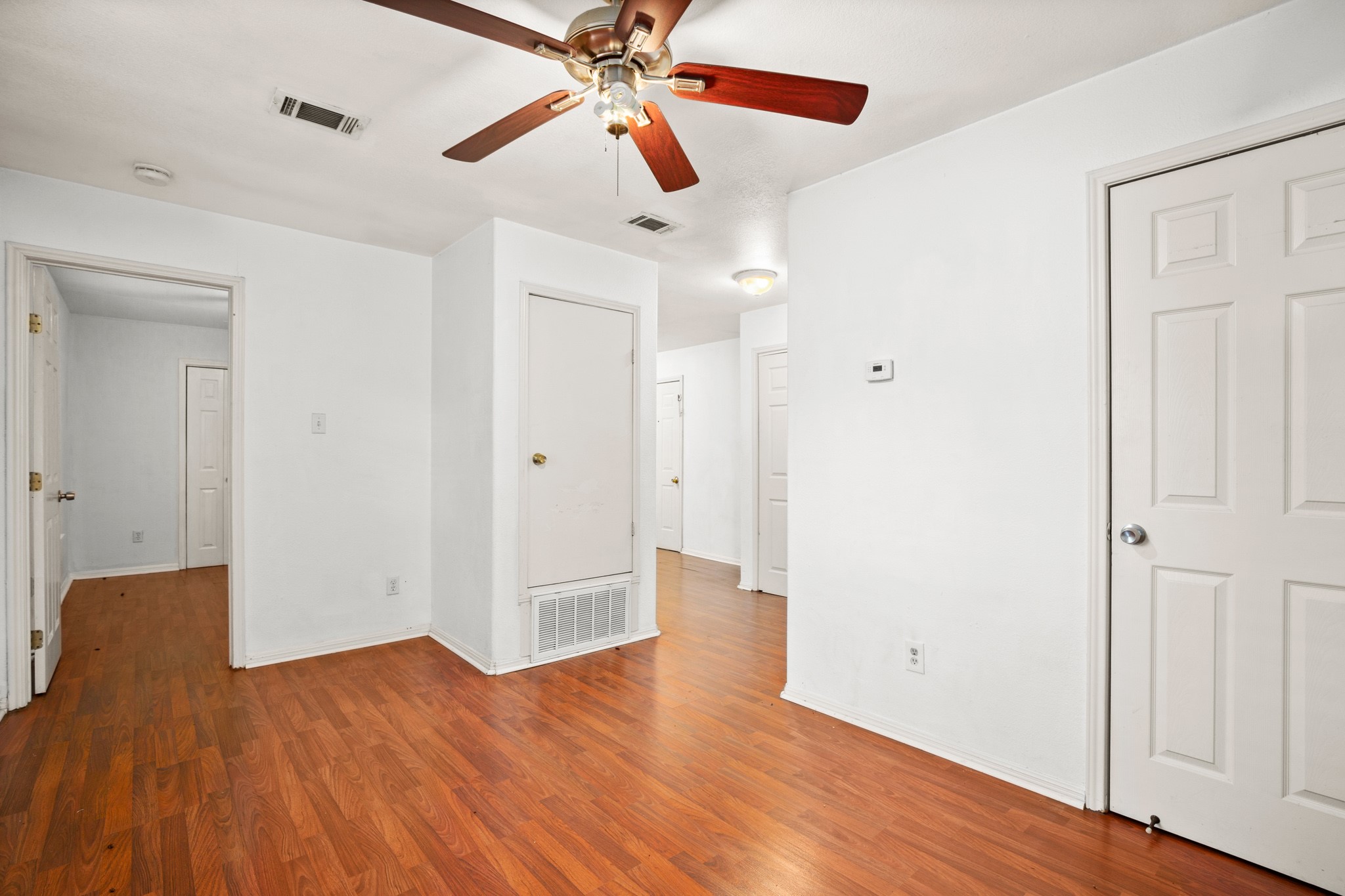 2610 East 3rd Street, Unit B Austin, TX 78702 - Photo 2 of 14 a view of an empty room with wooden floor
