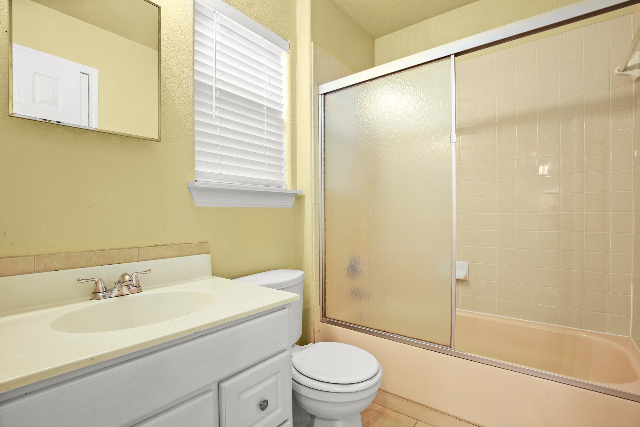 2610 East 3rd Street, Unit B Austin, TX 78702 - Photo 10 of 14 a bathroom with a sink toilet and shower