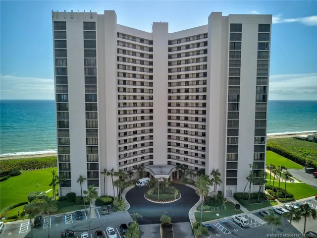 a front view of a building with outdoor seating