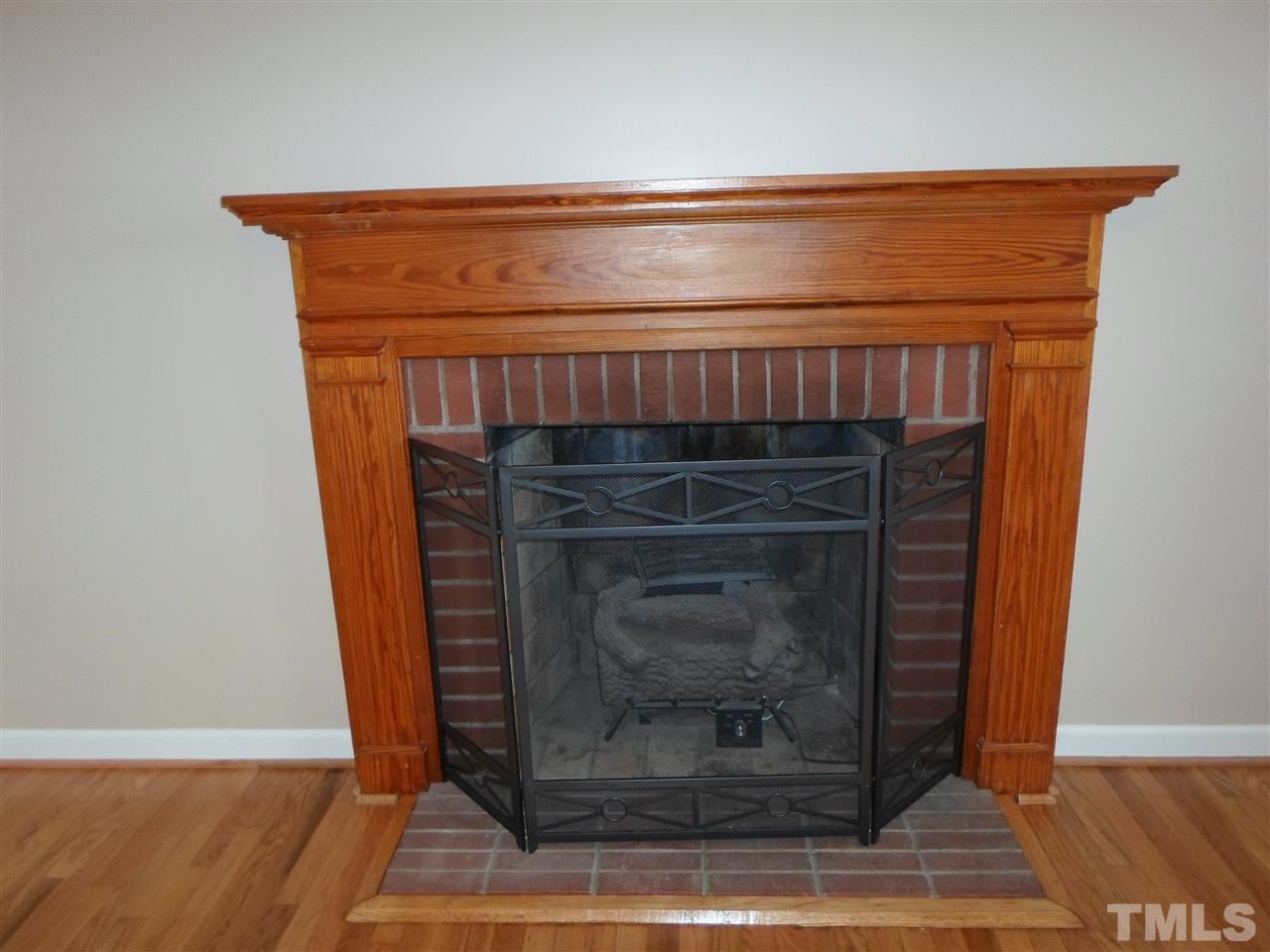 10913 Poole Road Wendell, NC 27591 - Photo 3 of 22 Fireplace with gas logs.