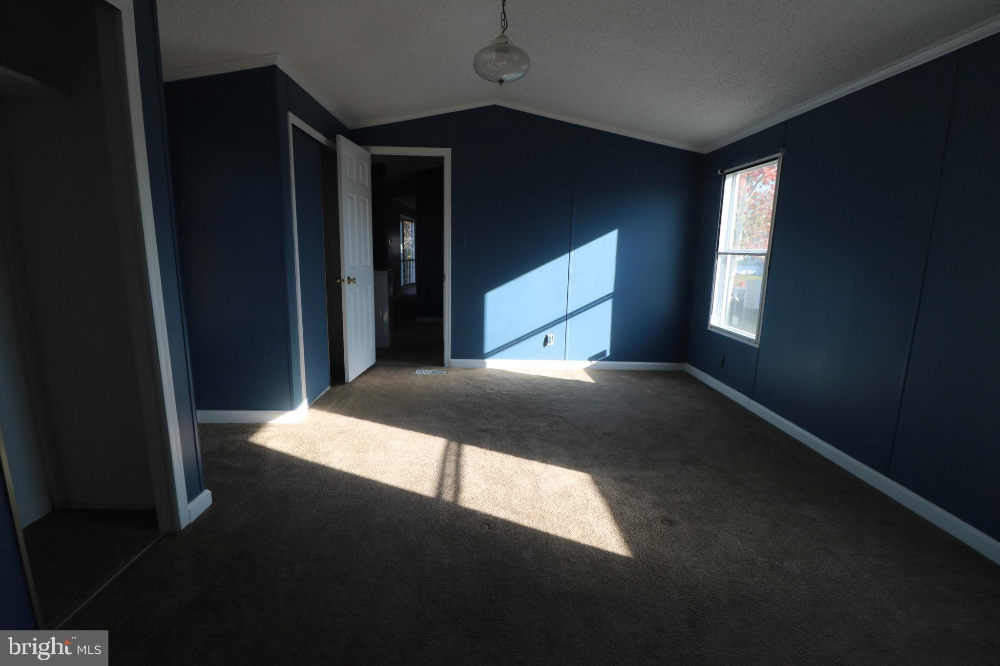 116 Roundup Road Middle River, MD 21220 - Photo 15 of 16 a bed sitting in a bedroom next to a window