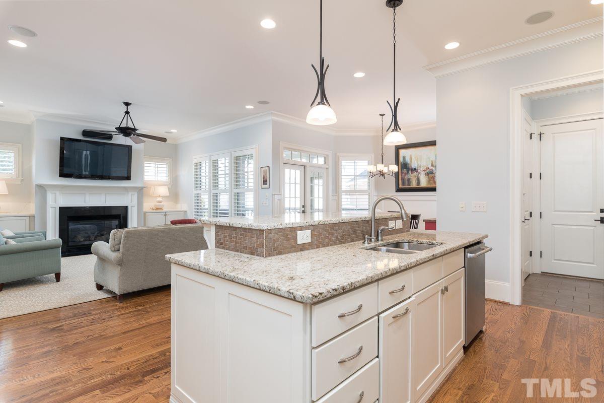 540 Guilford Circle Raleigh, NC 27608 - Photo 13 of 25 a bathroom with a granite countertop sink window and a fireplace