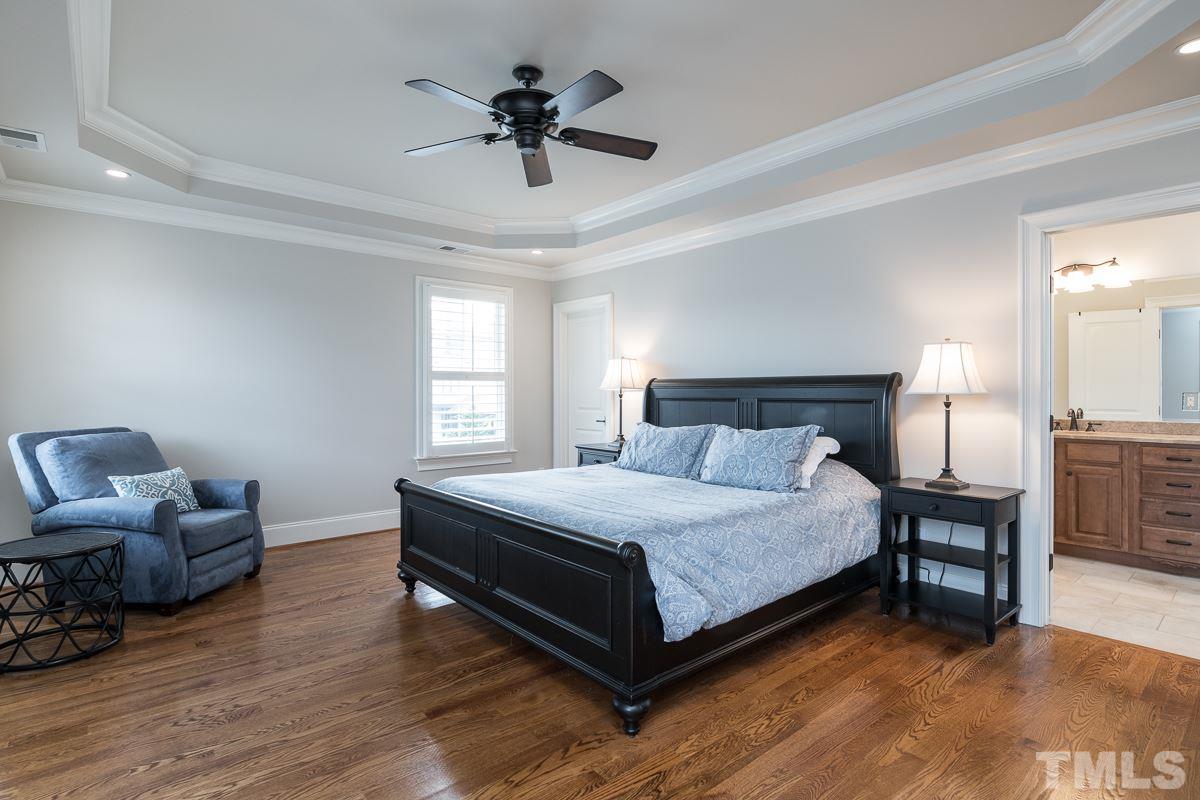 540 Guilford Circle Raleigh, NC 27608 - Photo 14 of 25 a bedroom with a bed and a couch