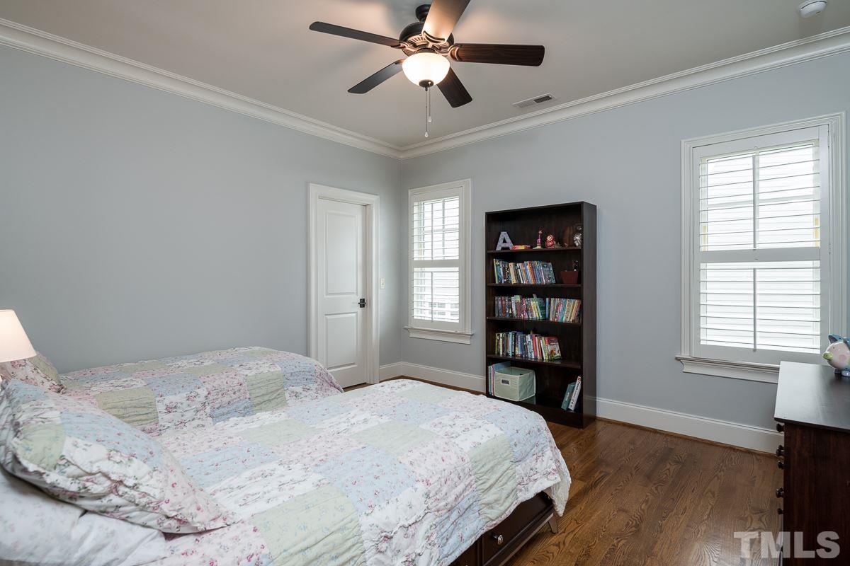 540 Guilford Circle Raleigh, NC 27608 - Photo 17 of 25 a bedroom with a bed furniture and a window