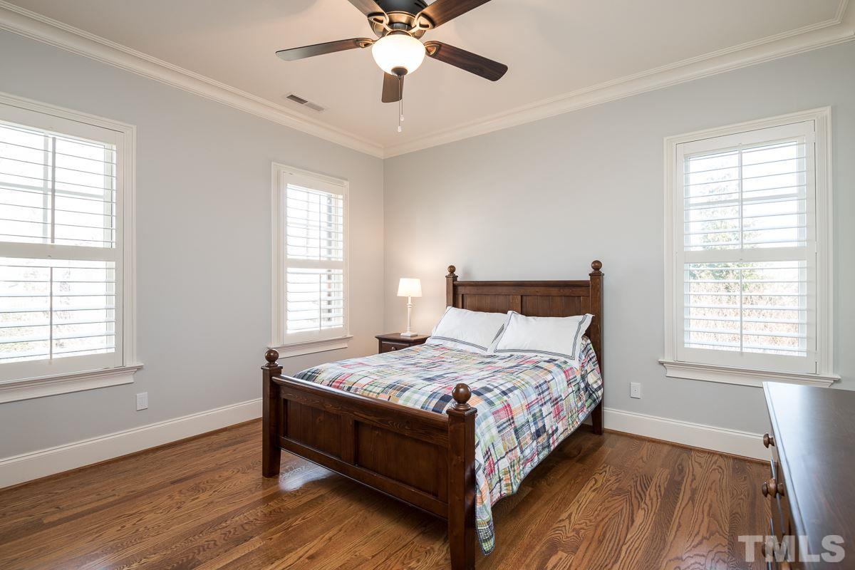 540 Guilford Circle Raleigh, NC 27608 - Photo 20 of 25 a bedroom with a bed and window