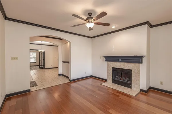 a view of a livingroom with a fireplace and wooden floor