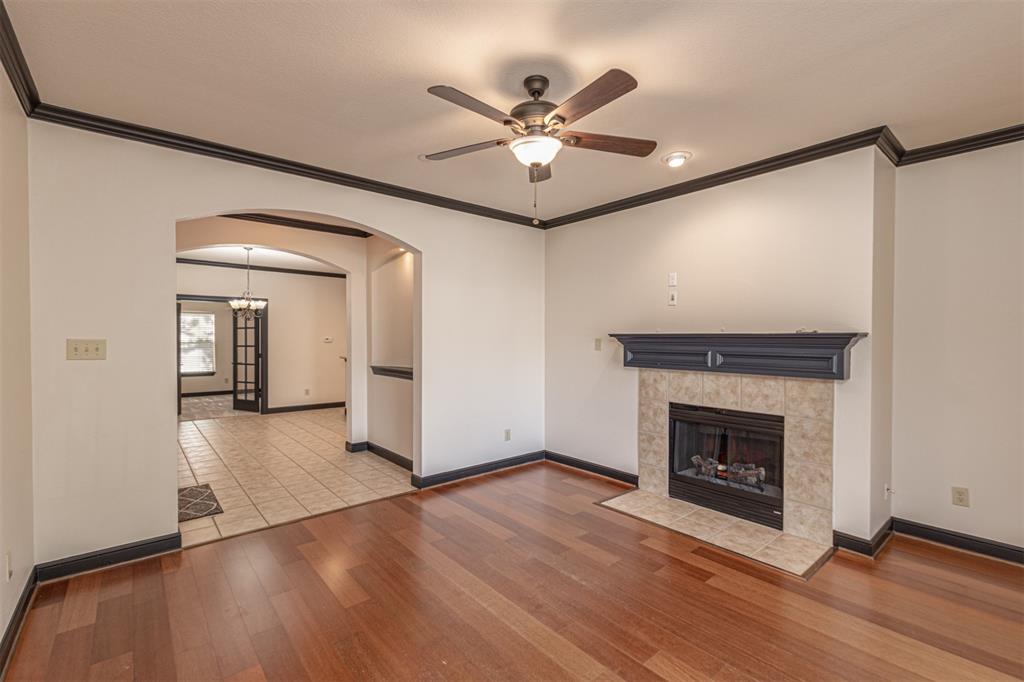 1871 Signal Ridge Place Rockwall, TX 75032 - Photo 1 of 26 a view of a livingroom with a fireplace and wooden floor