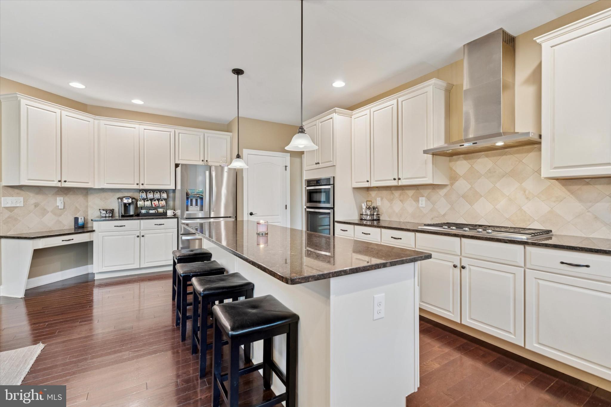 124 Bennington Road Phoenixville, PA 19460 - Photo 13 of 54 a kitchen with stainless steel appliances granite countertop a stove refrigerator sink and cabinets