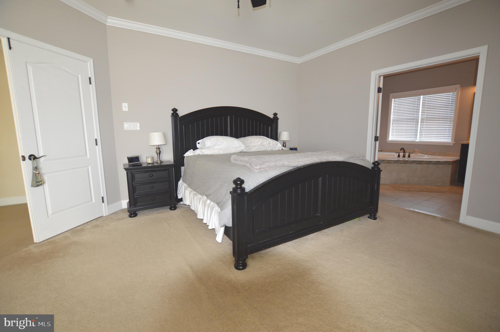 124 Bennington Road Phoenixville, PA 19460 - Photo 23 of 54 a bedroom with a bed and a mirror