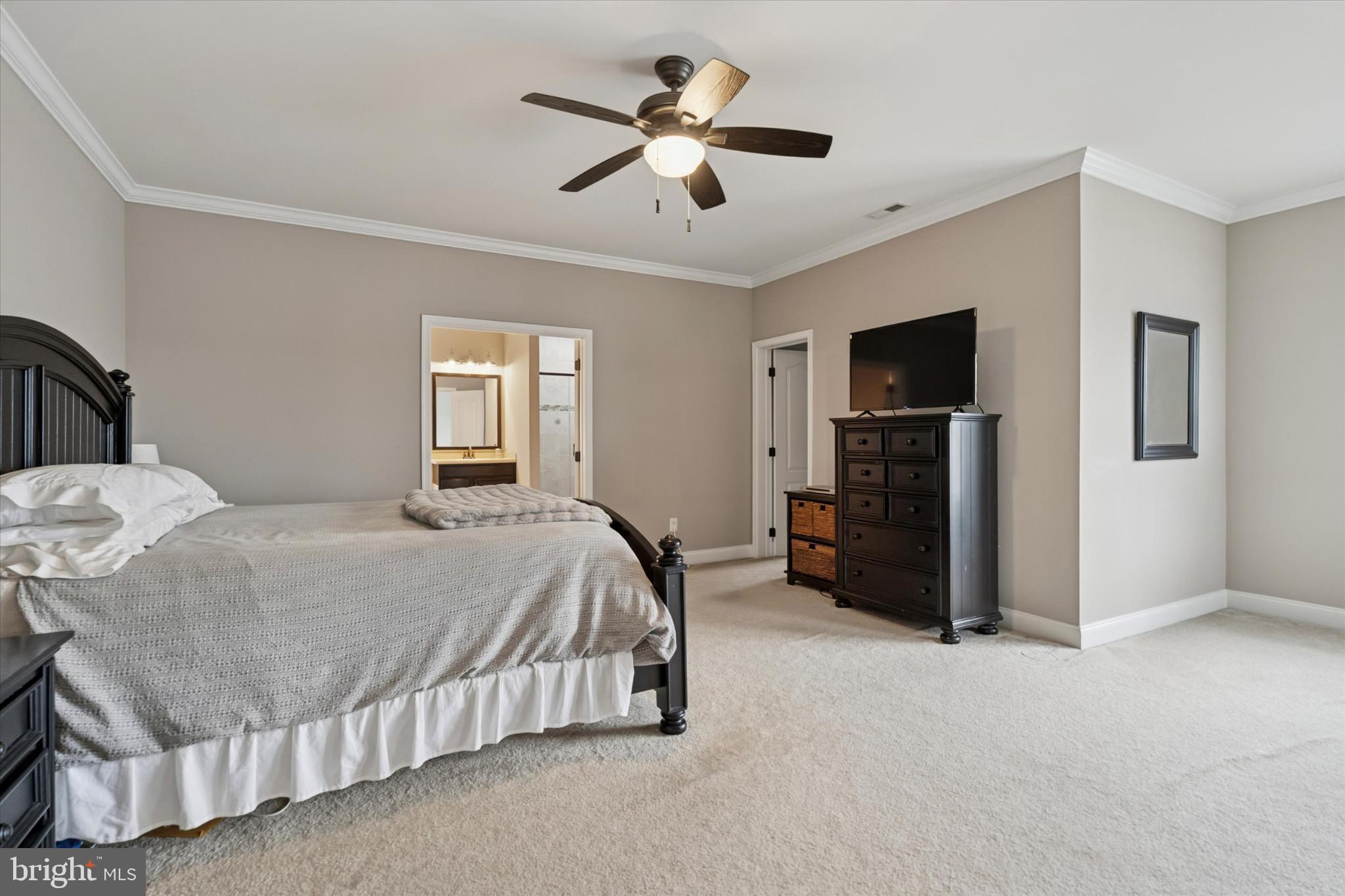 124 Bennington Road Phoenixville, PA 19460 - Photo 25 of 54 a bedroom with a bed and a chandelier