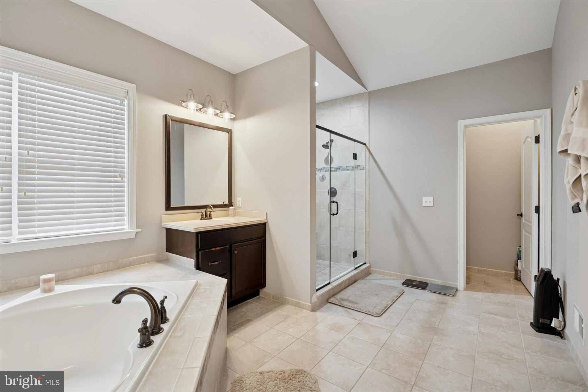 124 Bennington Road Phoenixville, PA 19460 - Photo 28 of 54 a spacious bathroom with a tub sink and mirror