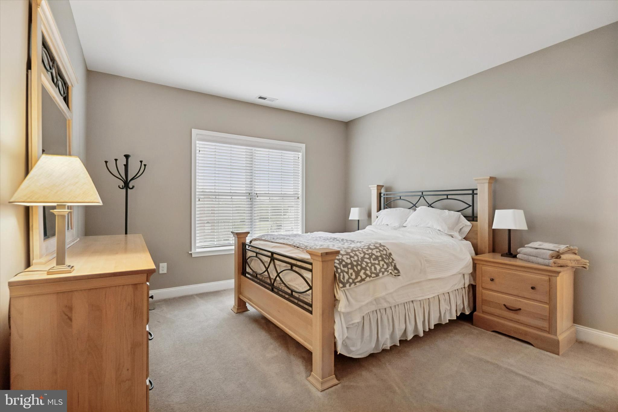 124 Bennington Road Phoenixville, PA 19460 - Photo 30 of 54 a bedroom with a bed and a table in it