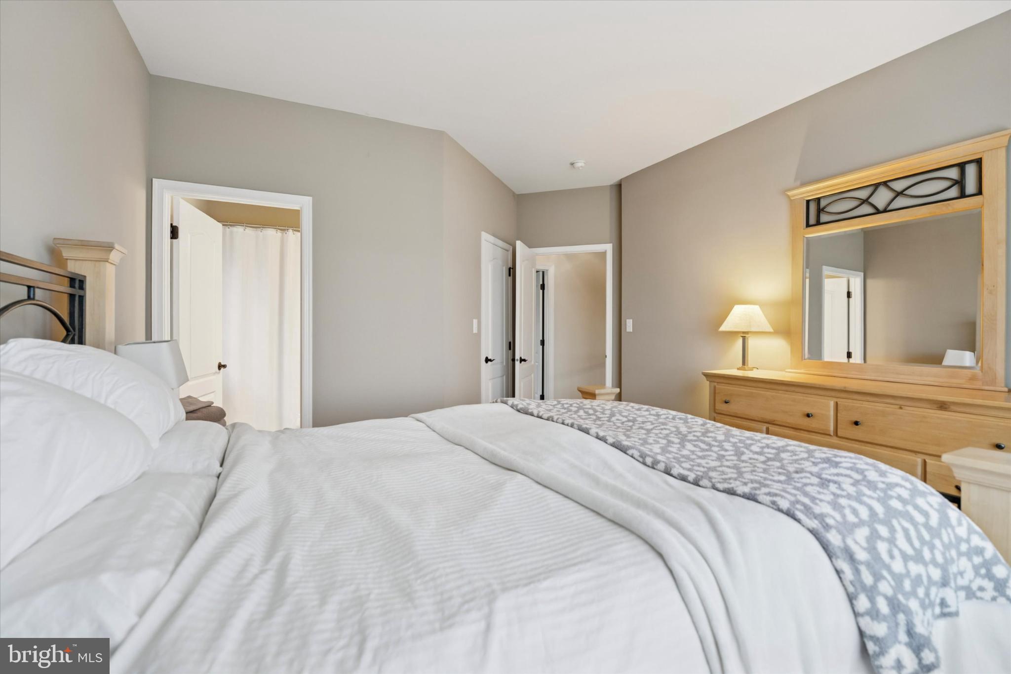 124 Bennington Road Phoenixville, PA 19460 - Photo 31 of 54 a bedroom with a bed and a mirror