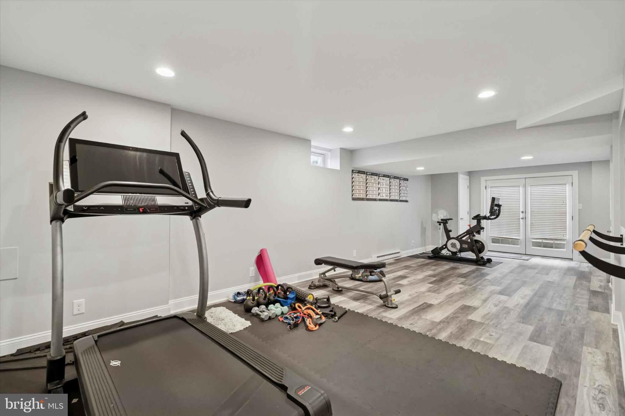 124 Bennington Road Phoenixville, PA 19460 - Photo 45 of 54 a room with gym equipment and a mirror