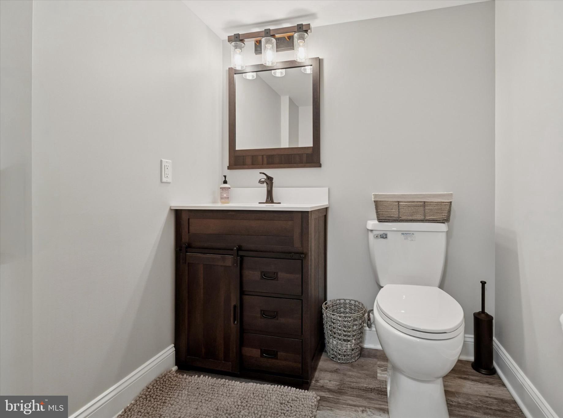124 Bennington Road Phoenixville, PA 19460 - Photo 49 of 54 a bathroom with a toilet a sink and mirror