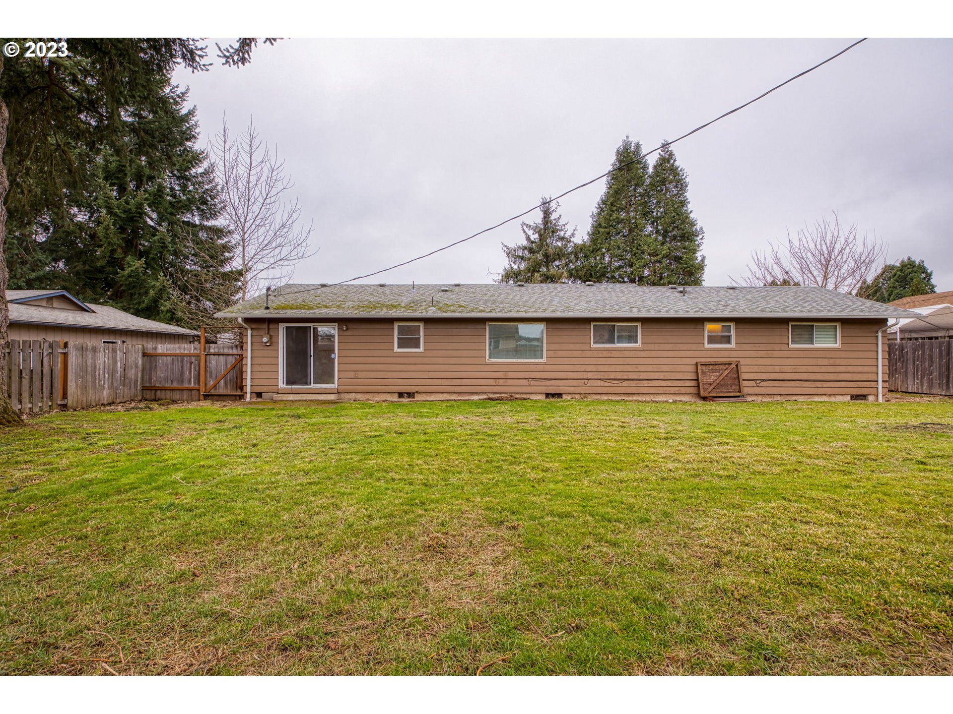 823 South 38th Street Springfield, OR 97478 - Photo 25 of 26 a view of a house with a backyard