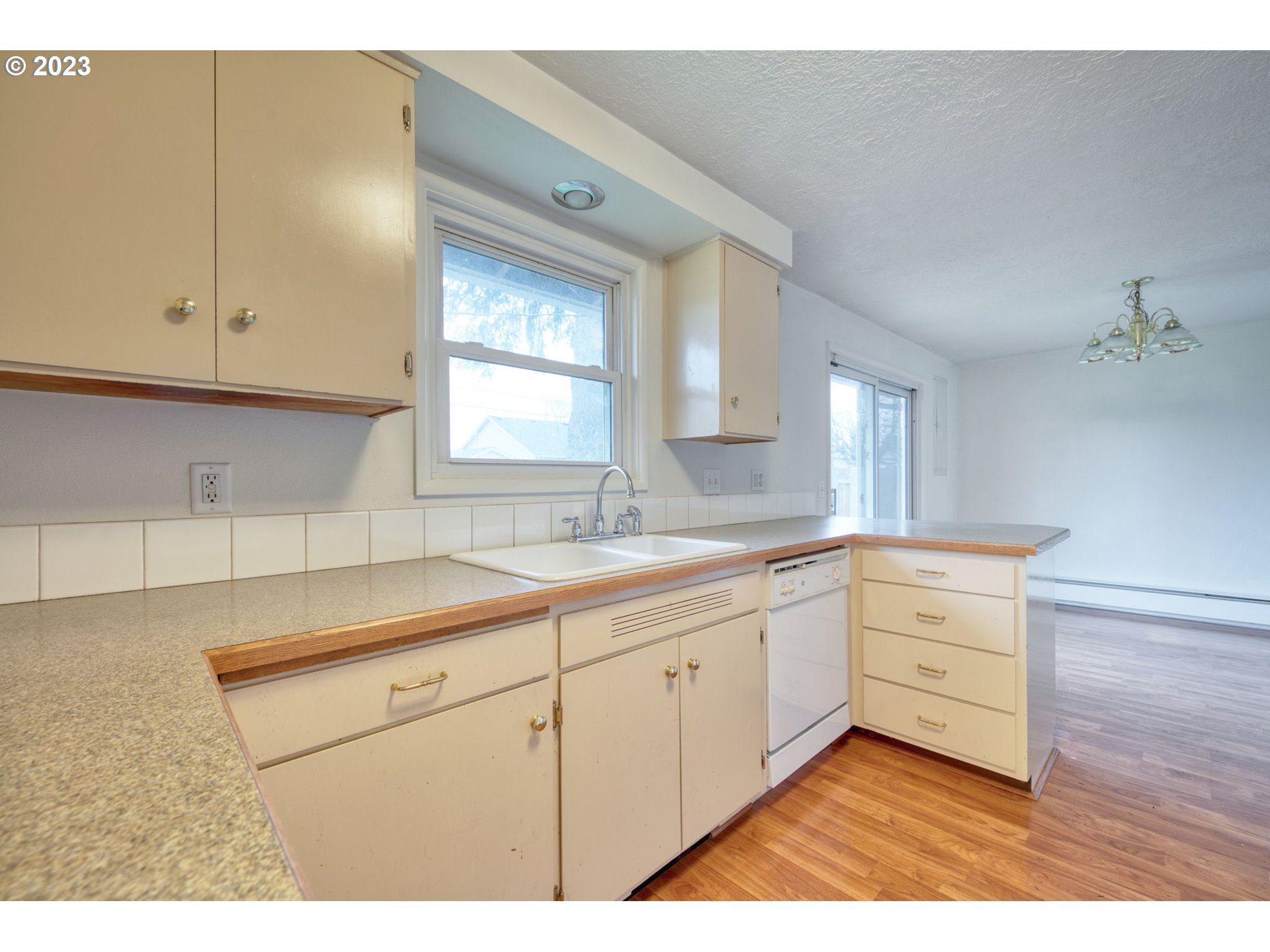 823 South 38th Street Springfield, OR 97478 - Photo 8 of 26 a kitchen with sink cabinets and window