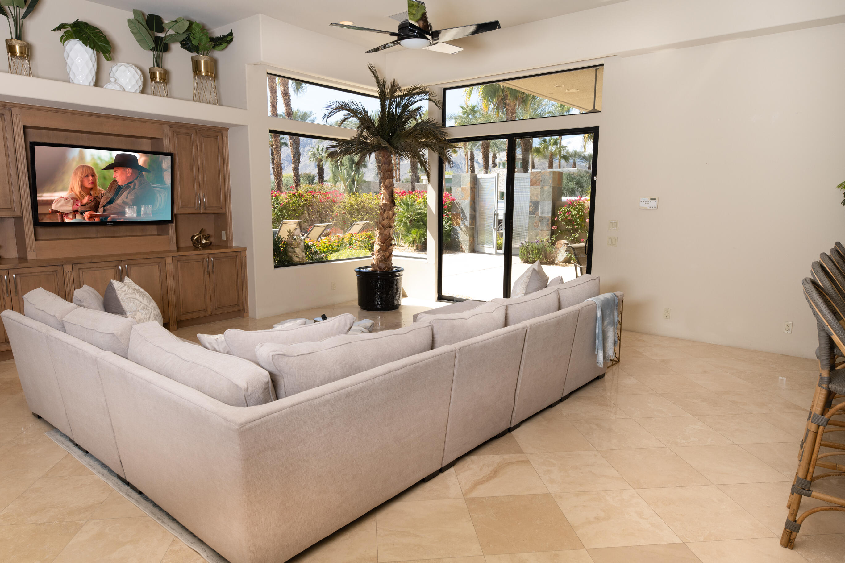 29 Sun Ridge Circle Rancho Mirage, CA 92270 - Photo 13 of 57 a living room with furniture a large window with kitchen view