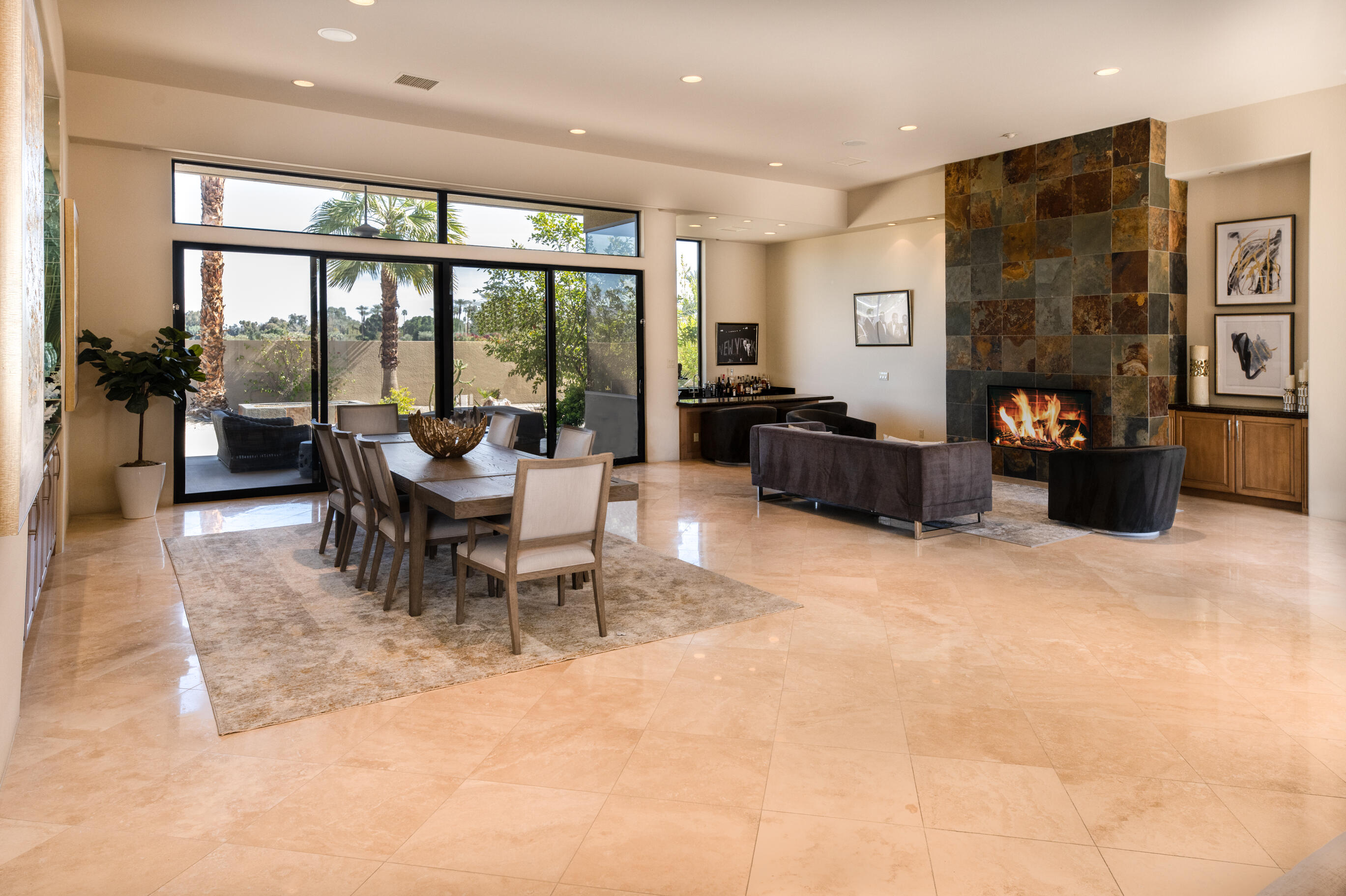 29 Sun Ridge Circle Rancho Mirage, CA 92270 - Photo 14 of 57 a living room with fireplace furniture and a large window