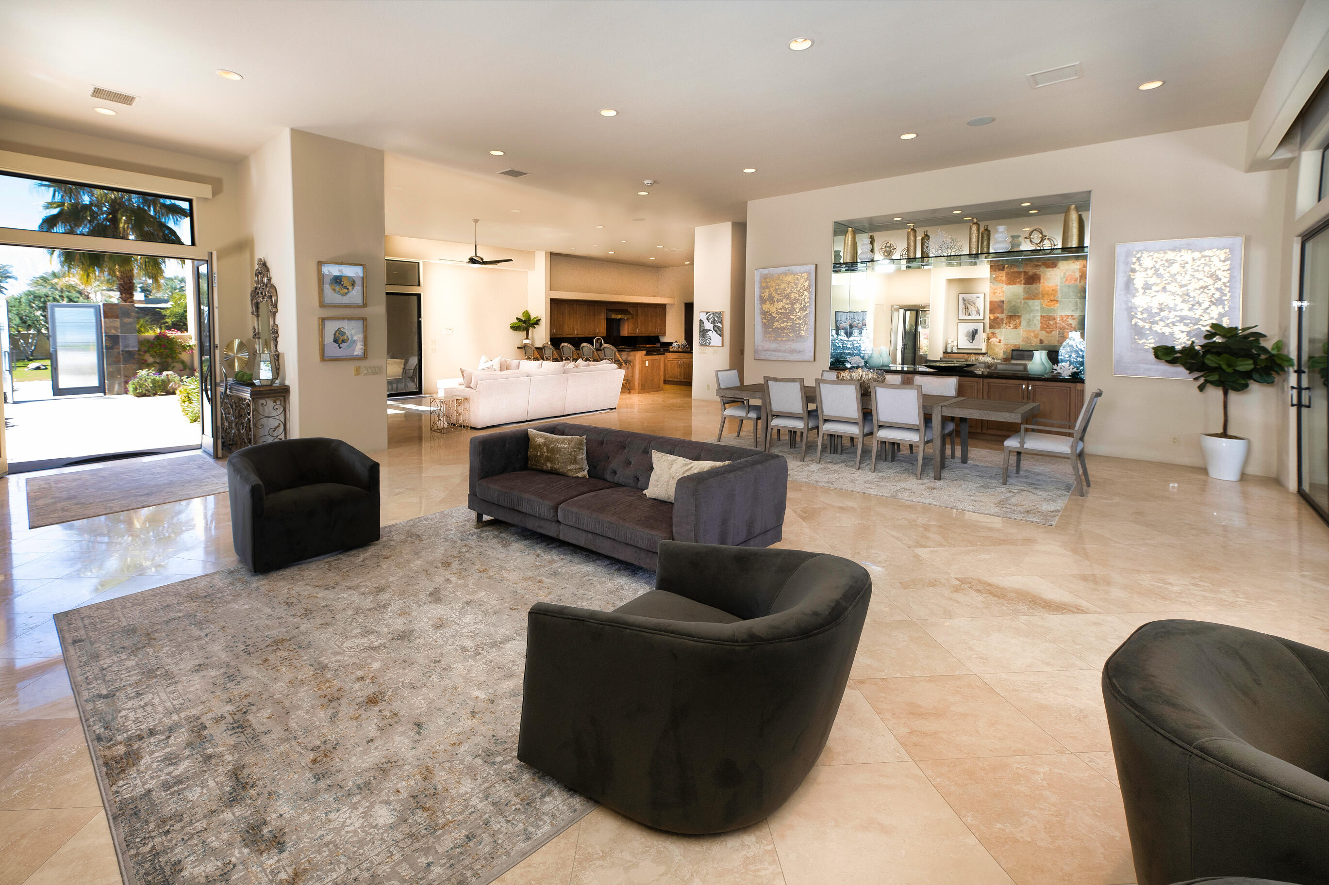 29 Sun Ridge Circle Rancho Mirage, CA 92270 - Photo 18 of 57 a living room with fireplace furniture and a view of kitchen