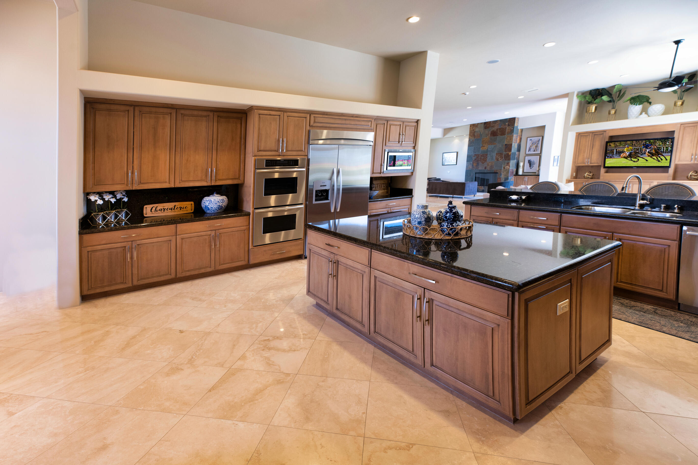 29 Sun Ridge Circle Rancho Mirage, CA 92270 - Photo 21 of 57 a kitchen with stainless steel appliances granite countertop a stove and a sink