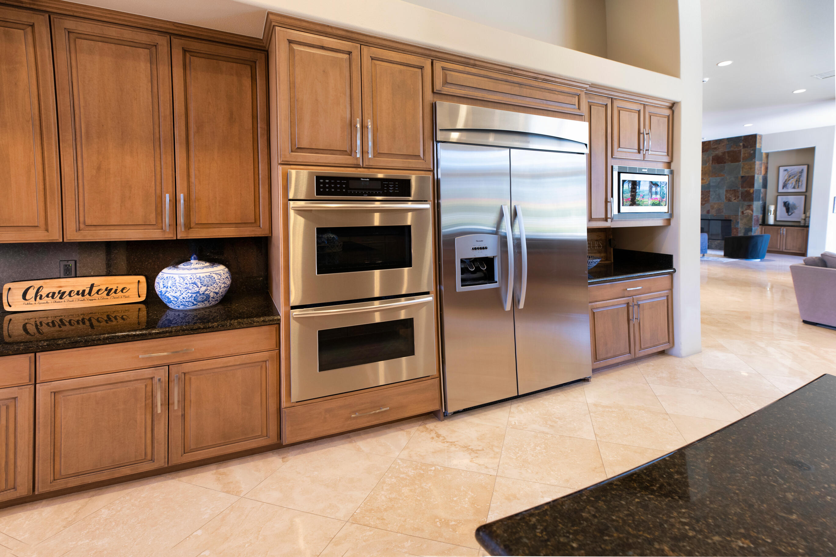 29 Sun Ridge Circle Rancho Mirage, CA 92270 - Photo 22 of 57 a kitchen with granite countertop a stove a sink and a microwave