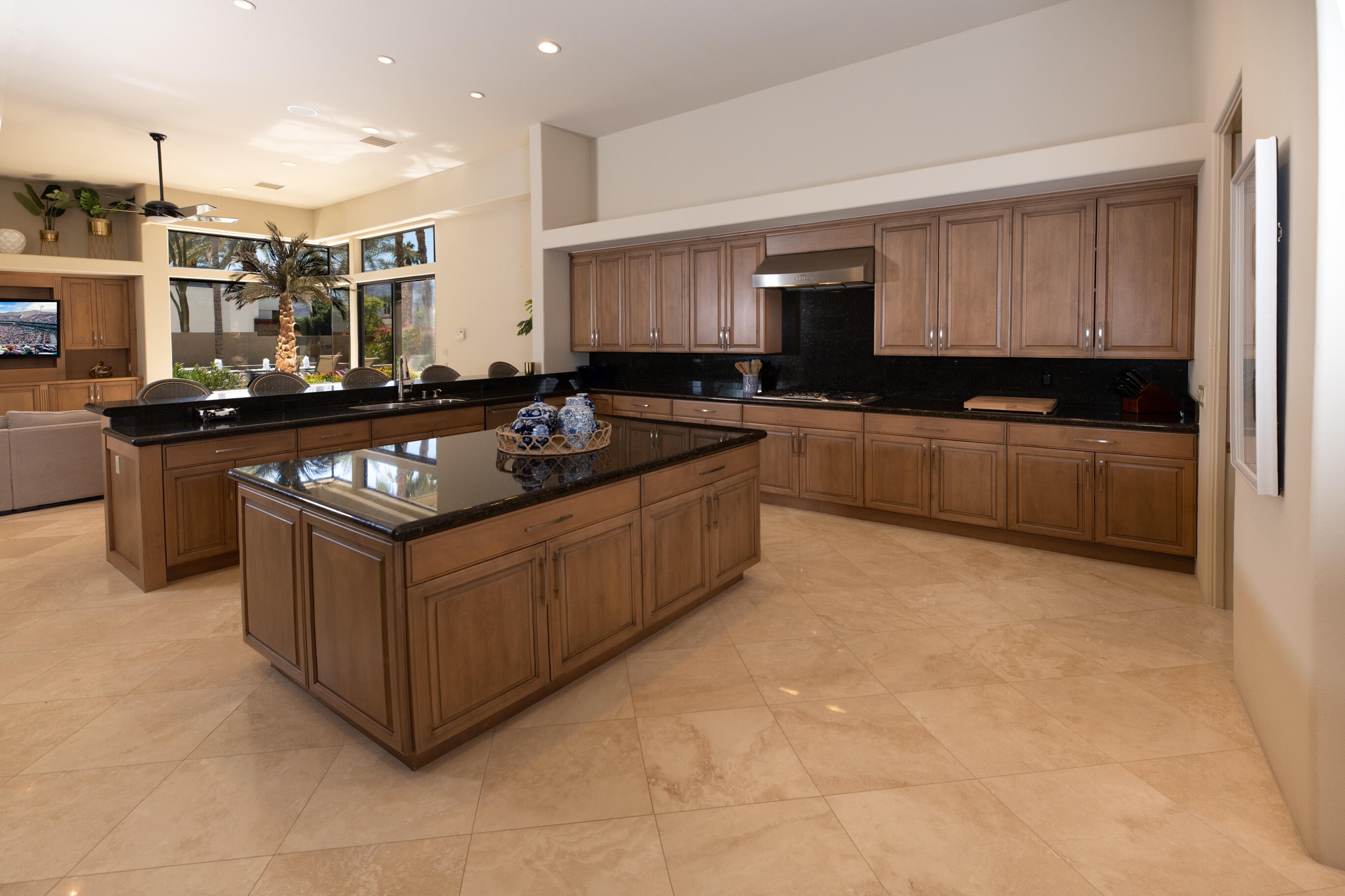 29 Sun Ridge Circle Rancho Mirage, CA 92270 - Photo 23 of 57 a kitchen with stainless steel appliances granite countertop a stove a sink and a microwave