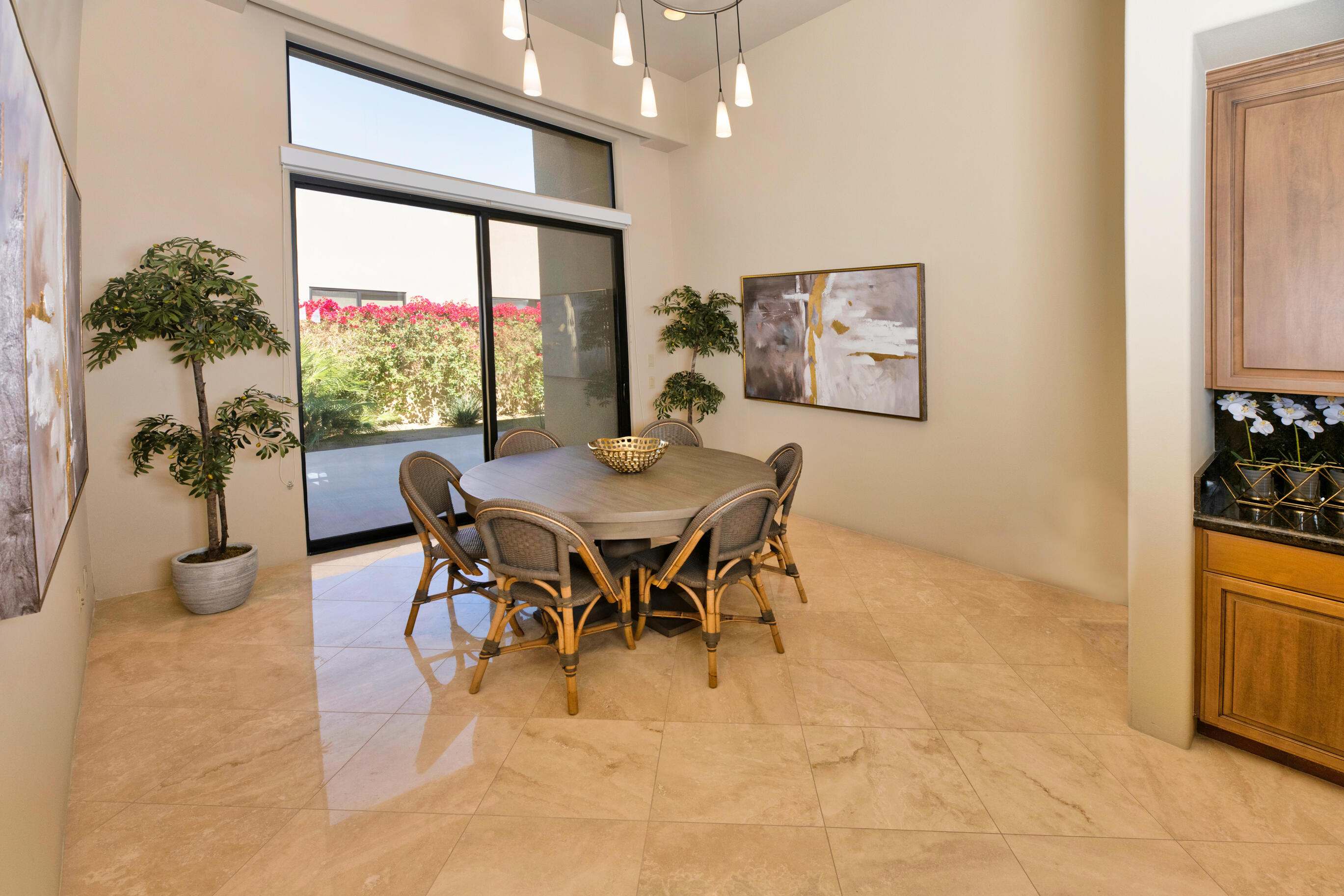 29 Sun Ridge Circle Rancho Mirage, CA 92270 - Photo 25 of 57 a dining room with furniture and a large window