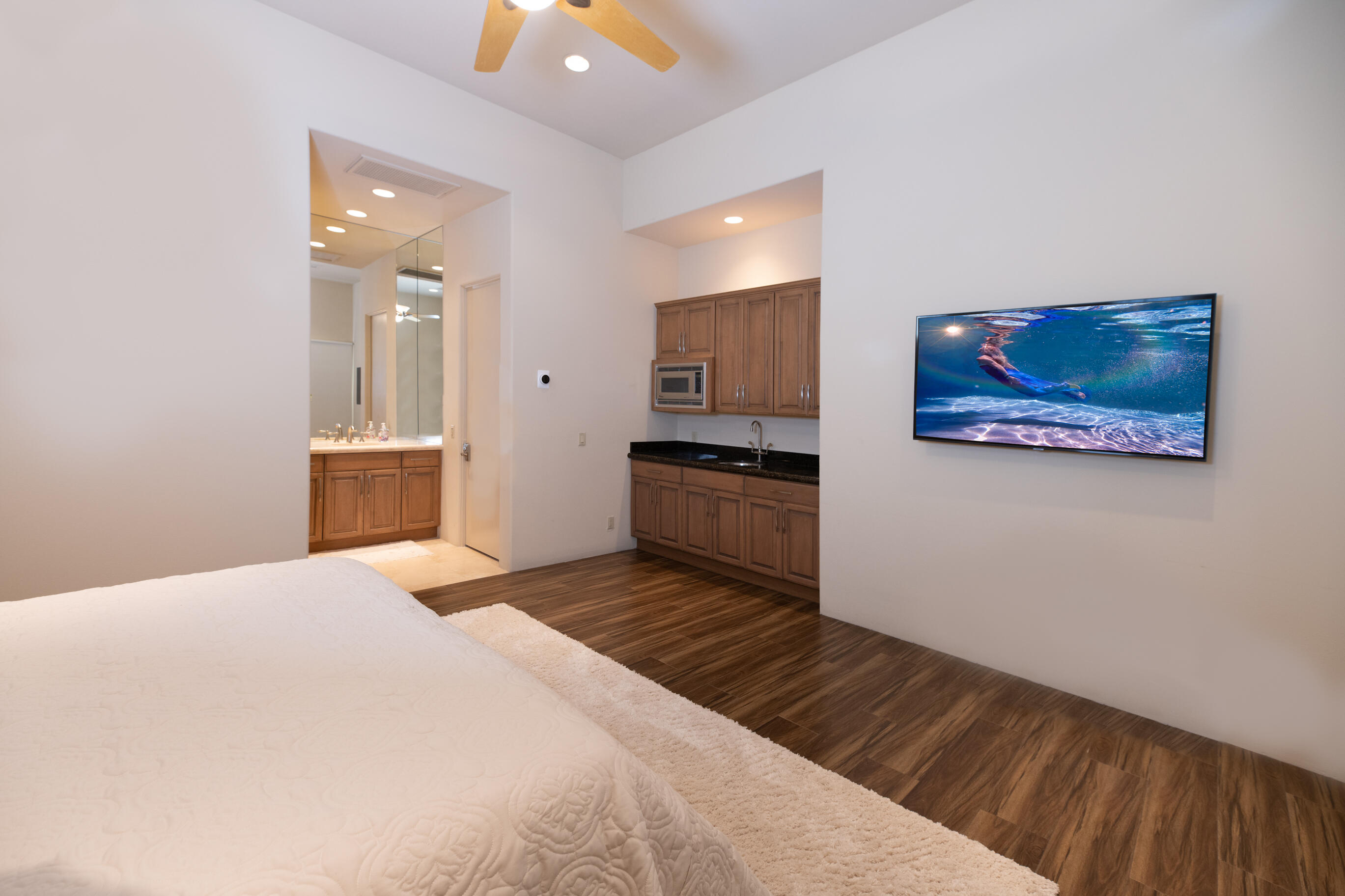 29 Sun Ridge Circle Rancho Mirage, CA 92270 - Photo 38 of 57 a bedroom with a bed and a view of kitchen