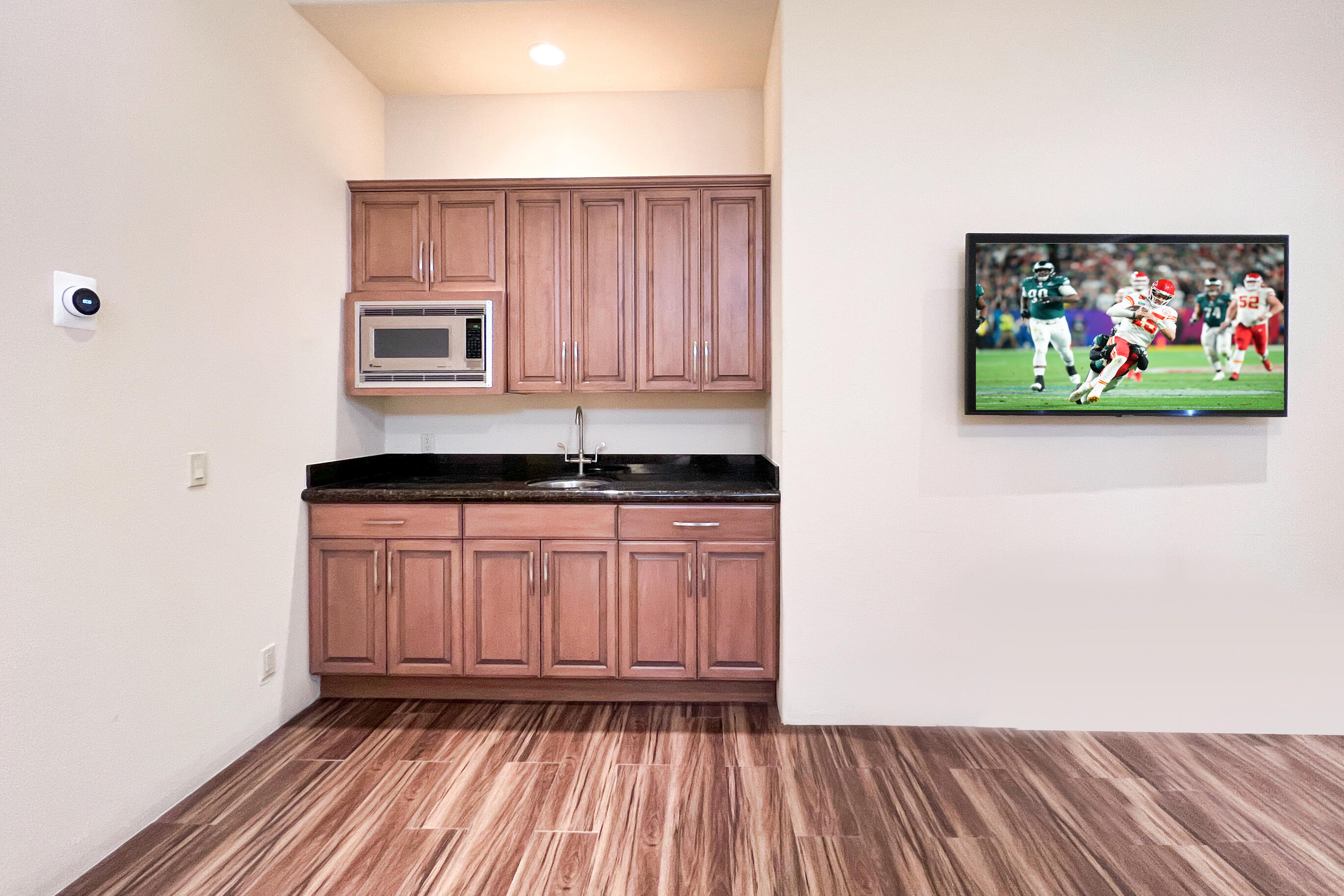 29 Sun Ridge Circle Rancho Mirage, CA 92270 - Photo 41 of 57 a kitchen with wooden floor and a window