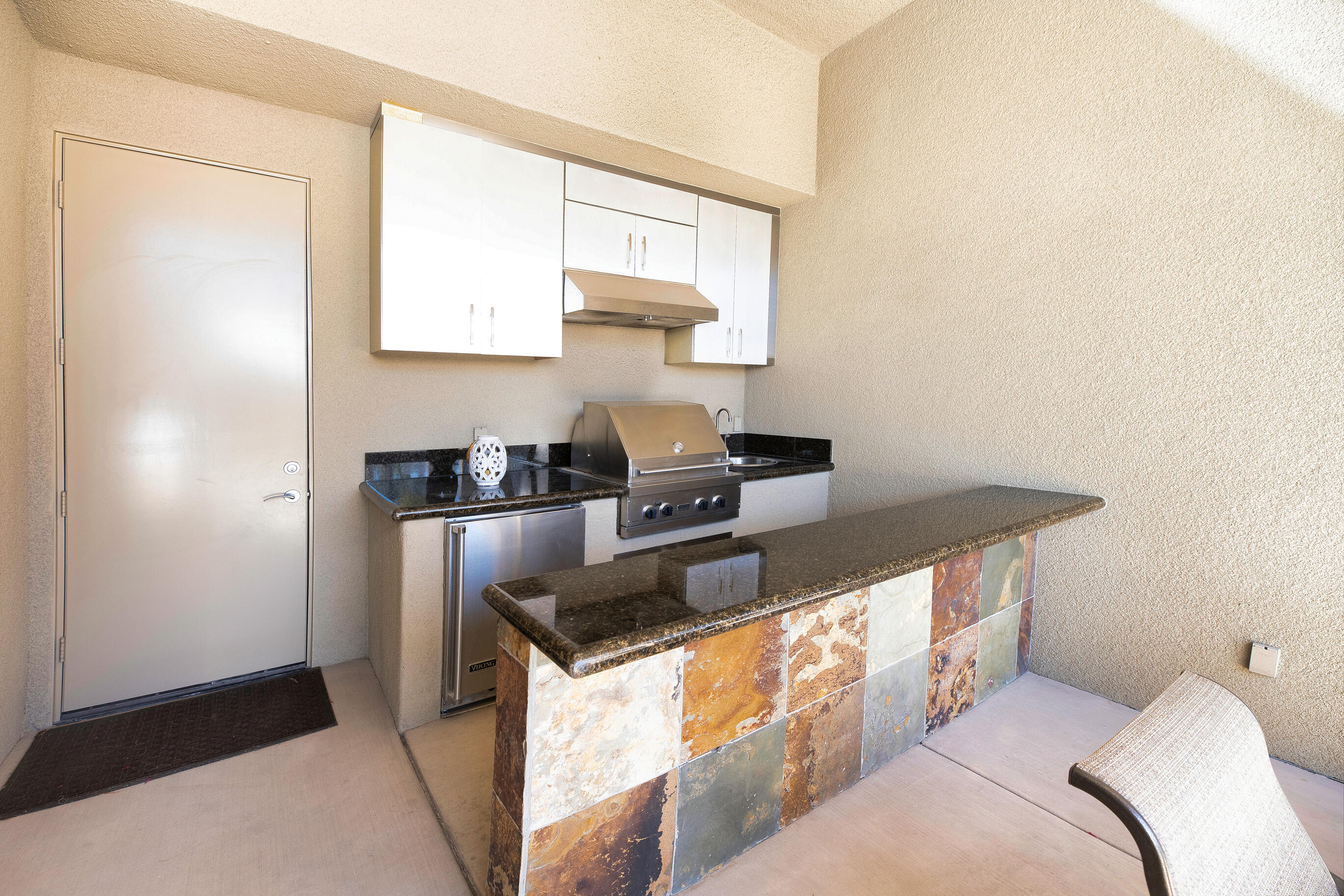 29 Sun Ridge Circle Rancho Mirage, CA 92270 - Photo 43 of 57 a kitchen with stainless steel appliances granite countertop a sink stove and refrigerator