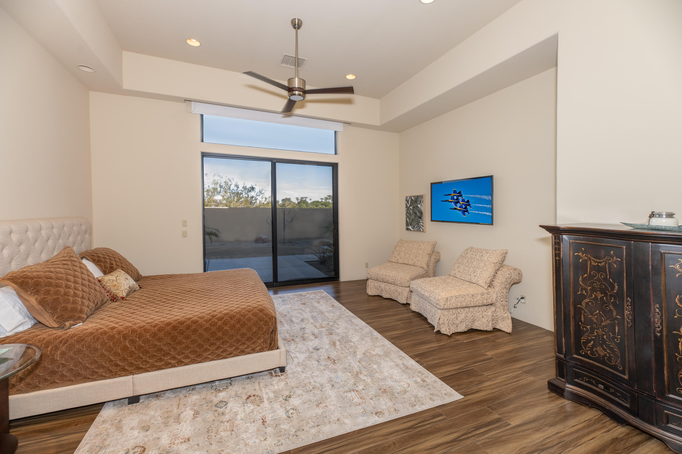 29 Sun Ridge Circle Rancho Mirage, CA 92270 - Photo 49 of 57 a bedroom with a bed couch and window