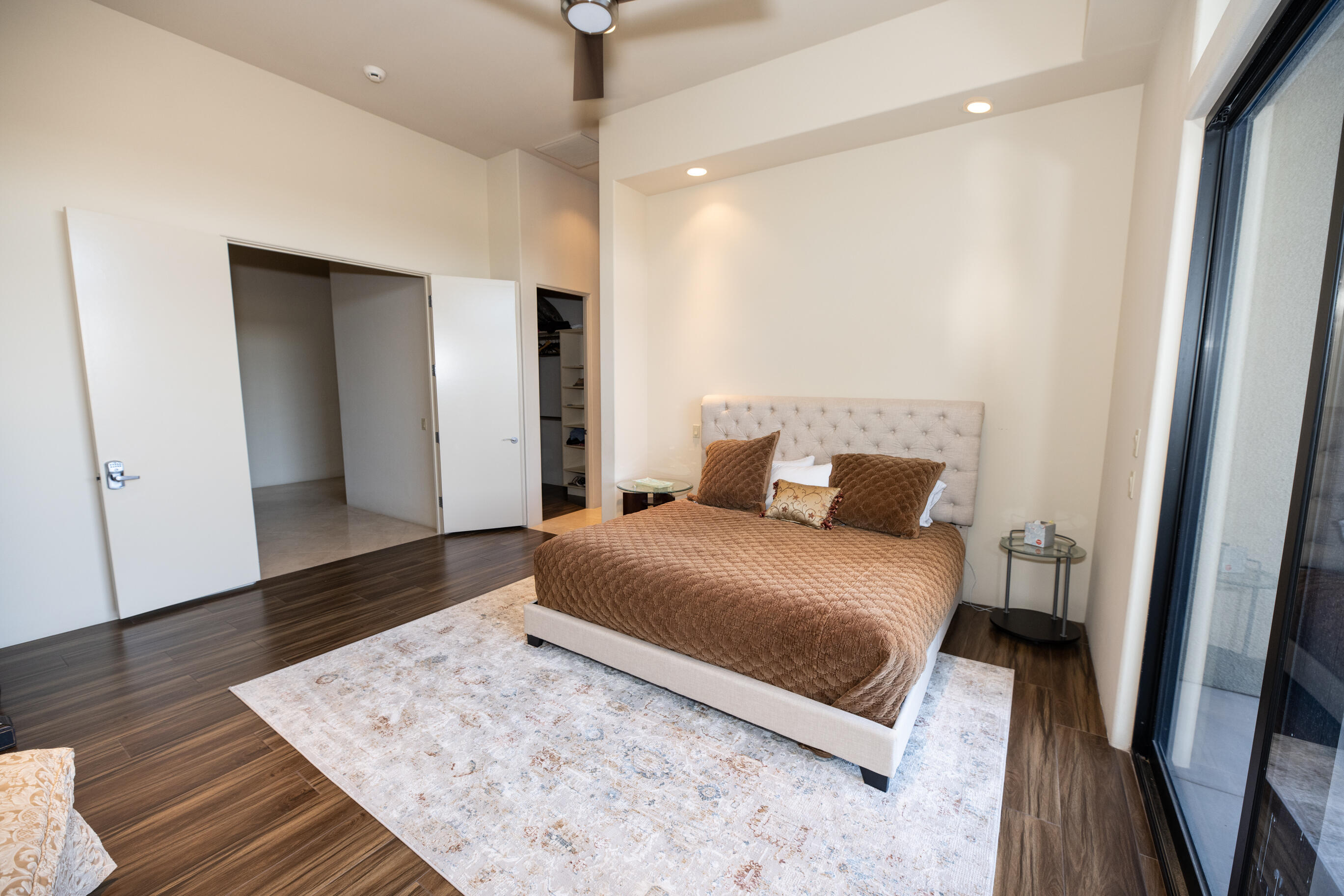 29 Sun Ridge Circle Rancho Mirage, CA 92270 - Photo 50 of 57 a bedroom with a bed and wooden floor