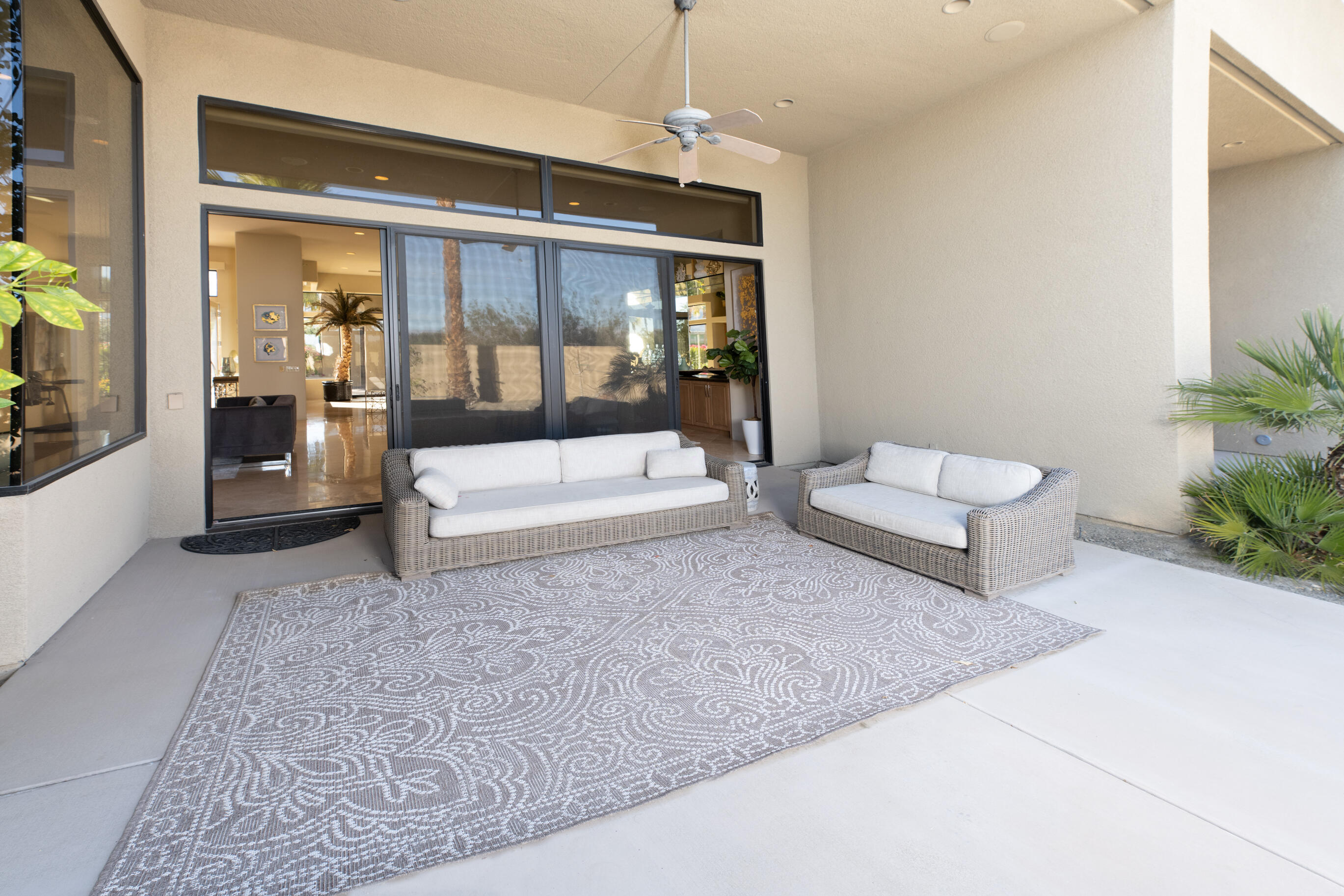 29 Sun Ridge Circle Rancho Mirage, CA 92270 - Photo 51 of 57 a living room with furniture and a large window