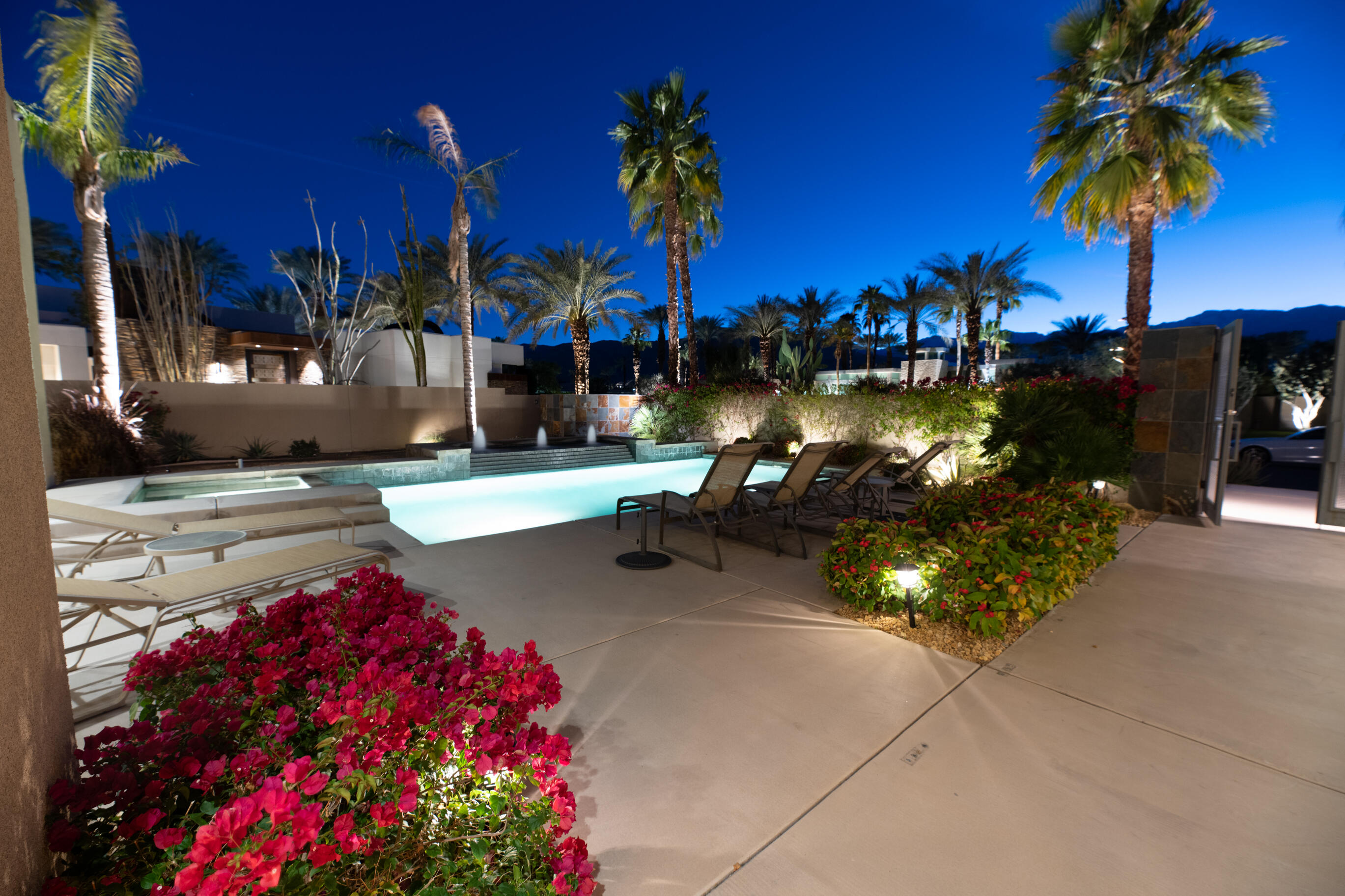29 Sun Ridge Circle Rancho Mirage, CA 92270 - Photo 7 of 57 a view of a street with flower and a building