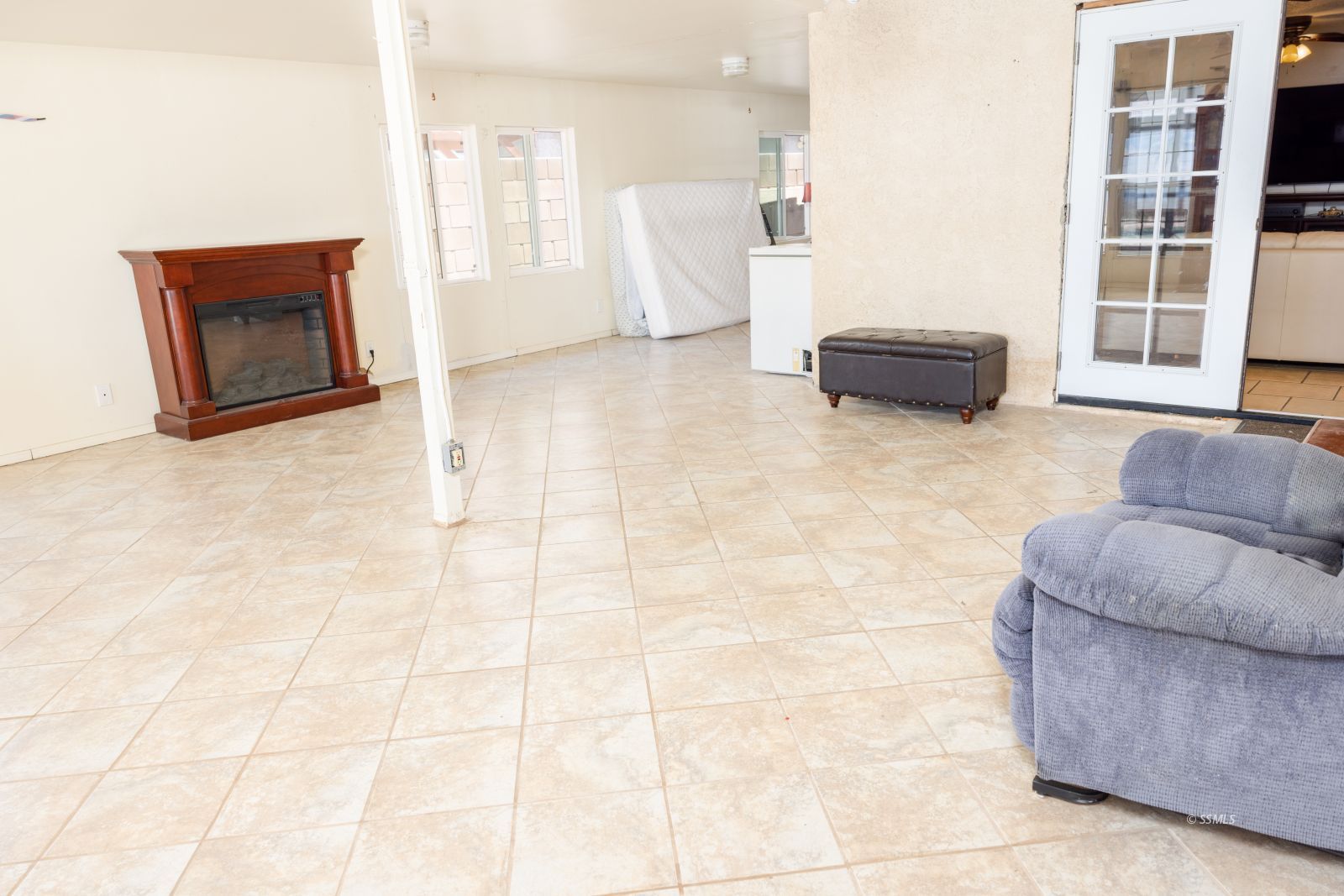 313 Larkspur Street Ridgecrest, CA 93555 - Photo 15 of 31 a living room with furniture a window and a couch