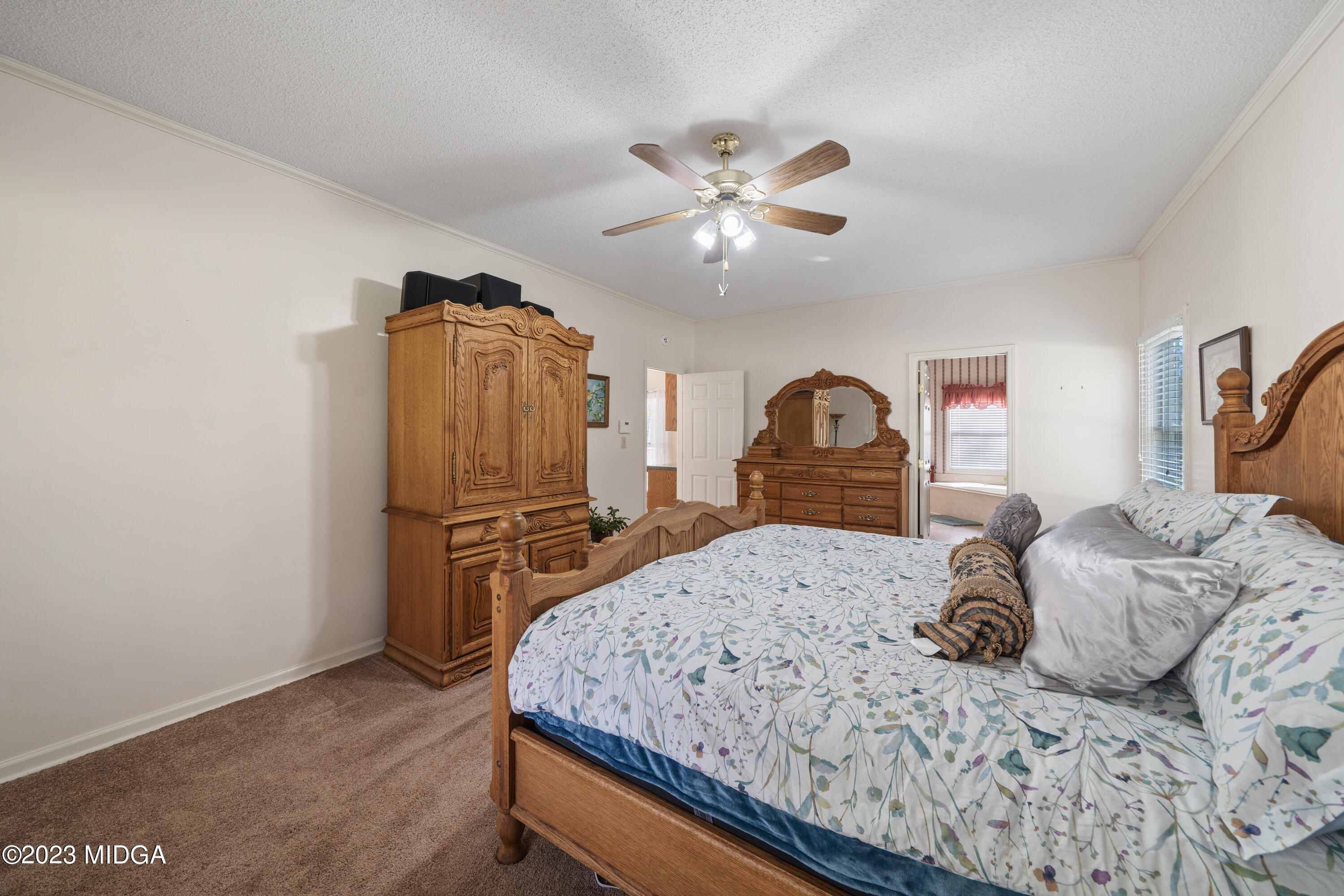 729 Sanders Road Macon, GA 31210 - Photo 13 of 29 a bedroom with a bed and dresser