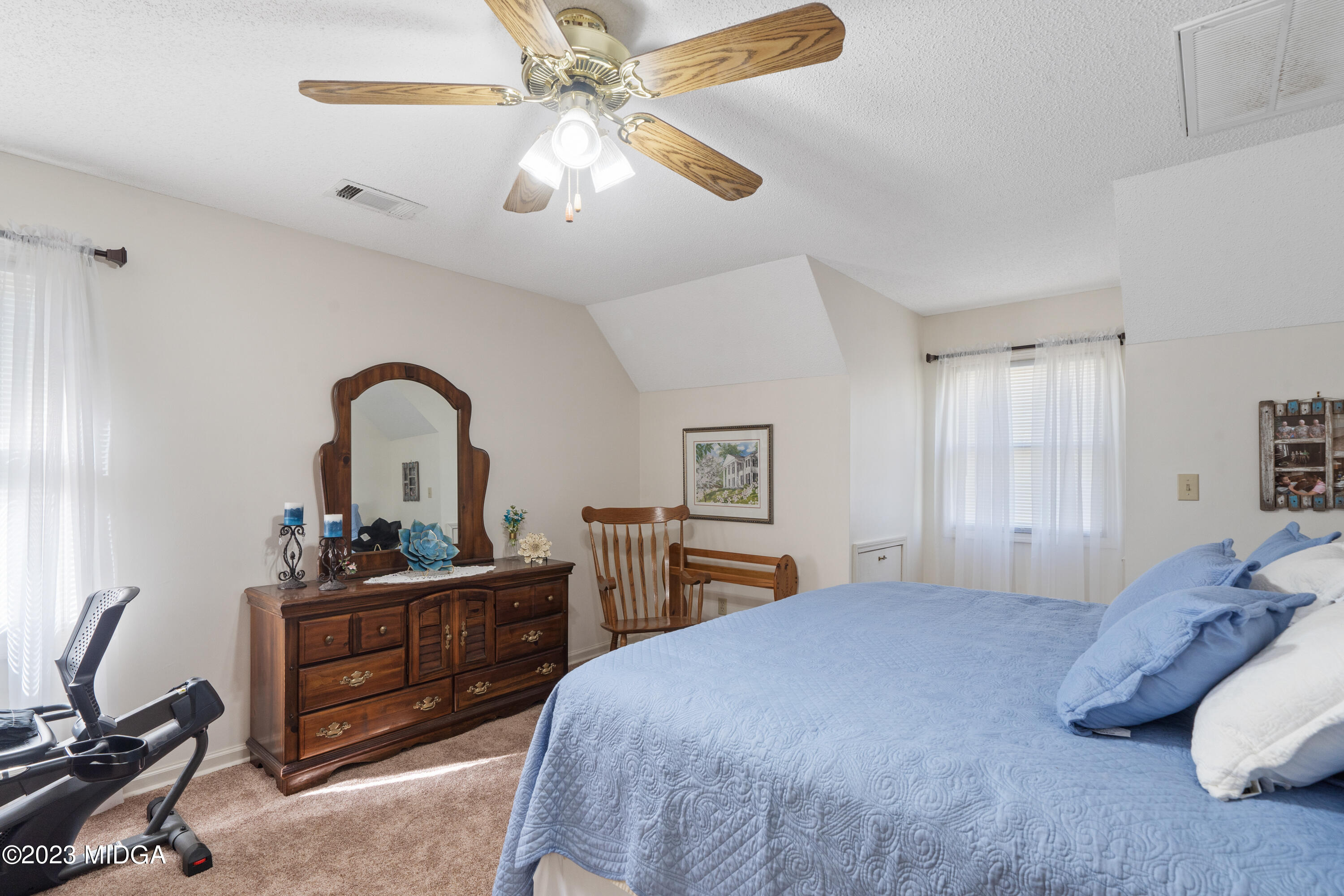 729 Sanders Road Macon, GA 31210 - Photo 17 of 29 a bedroom with a bed and a dresser