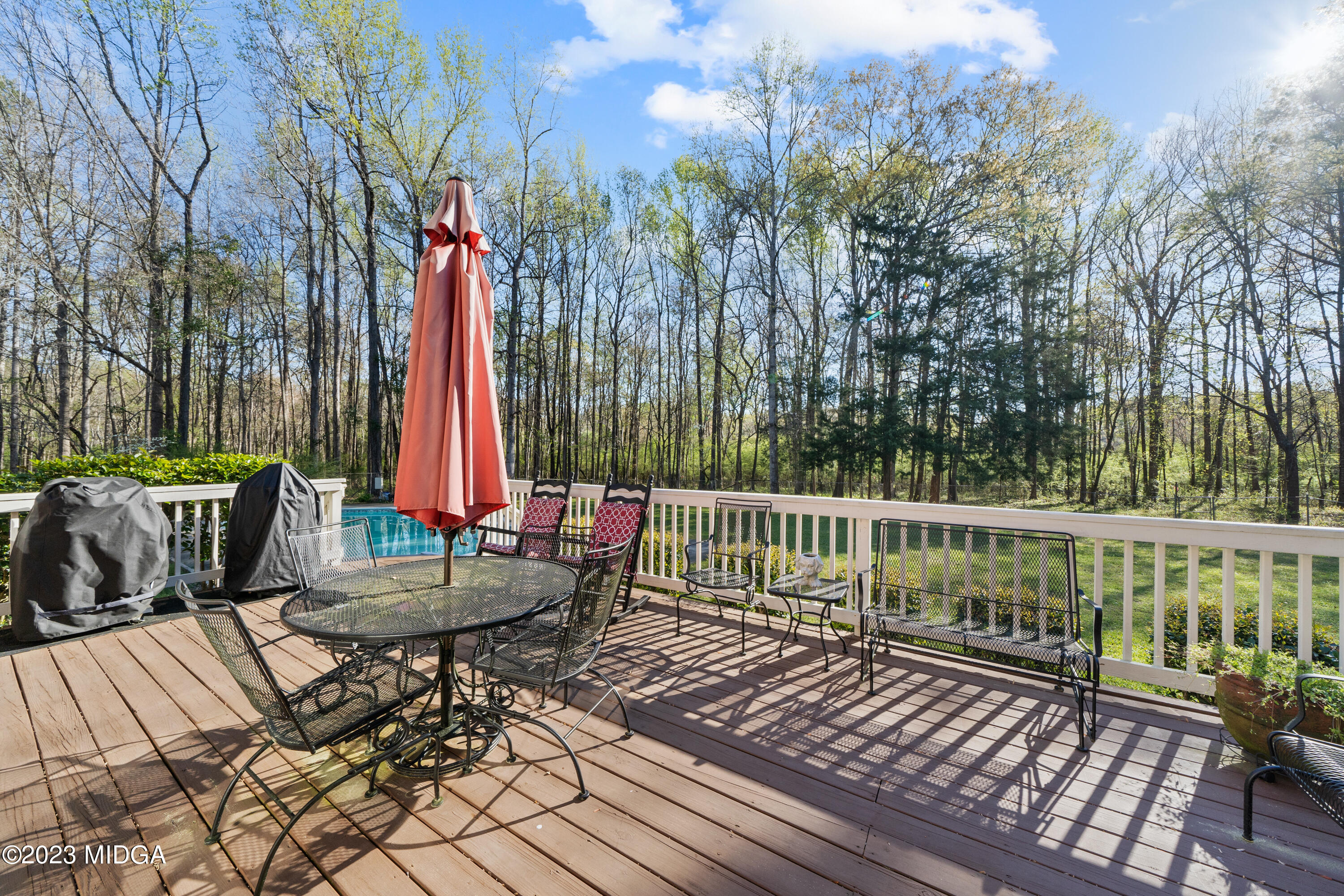 729 Sanders Road Macon, GA 31210 - Photo 22 of 29 a view of a chair and tables on the deck