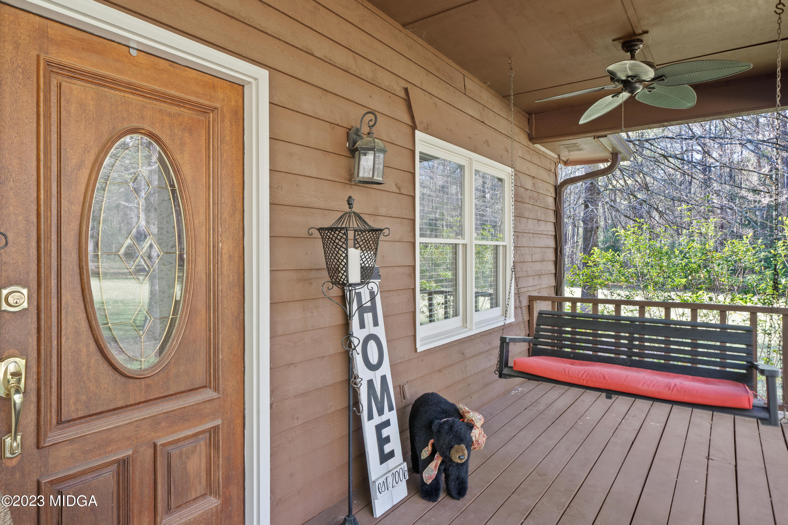 729 Sanders Road Macon, GA 31210 - Photo 23 of 29 a view of a livingroom with furniture wooden floor mirror and windows