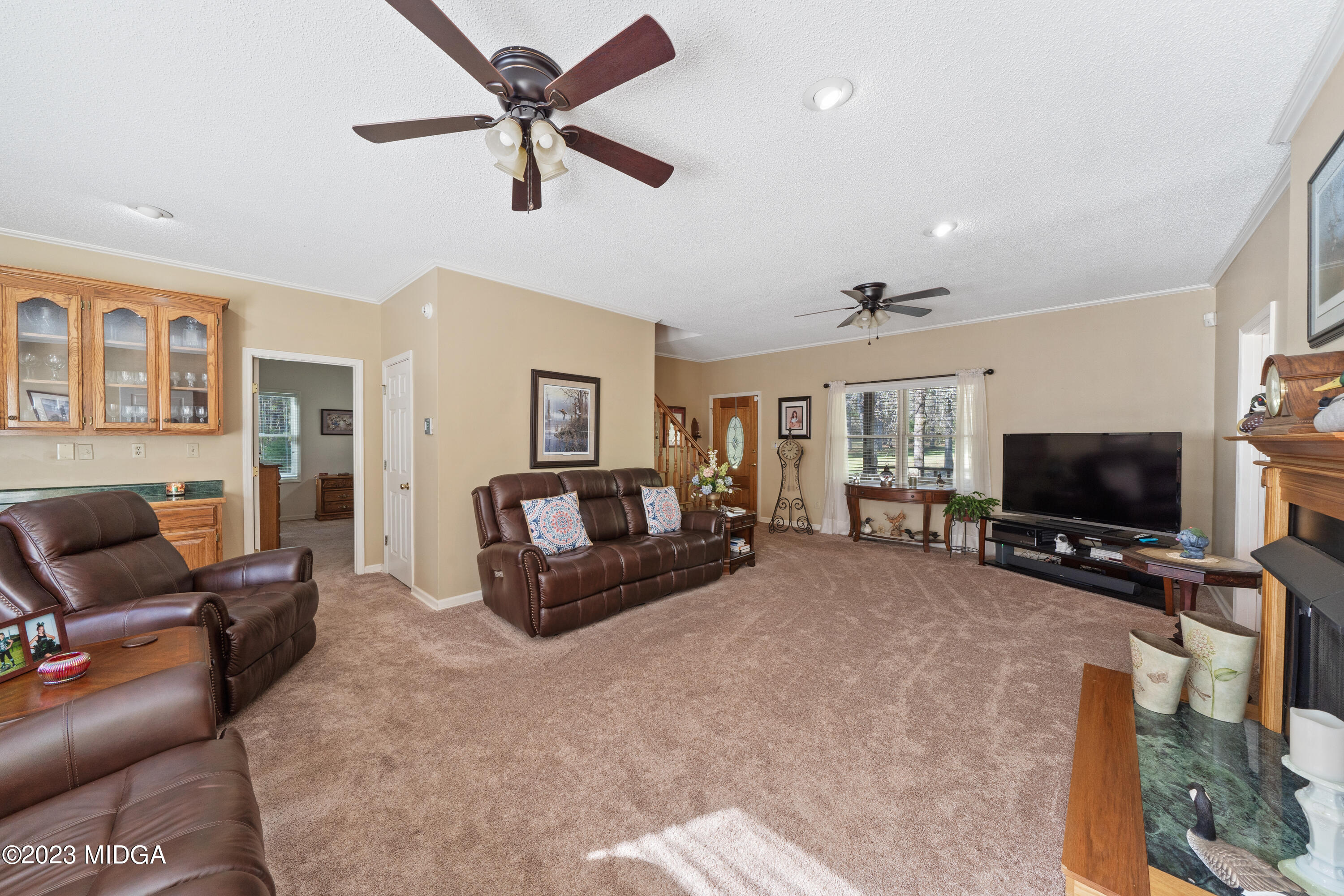 729 Sanders Road Macon, GA 31210 - Photo 3 of 29 a living room with furniture and a flat screen tv