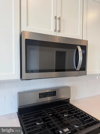 a kitchen with a stove and a microwave