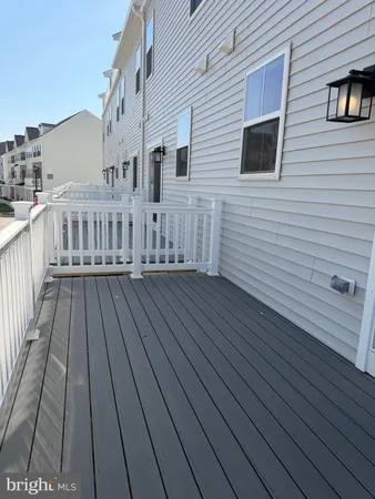 a view of a house with wooden deck