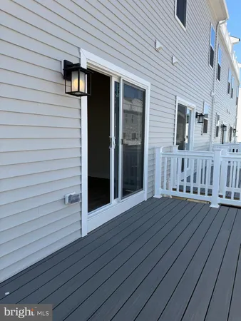 a view of a house with wooden deck
