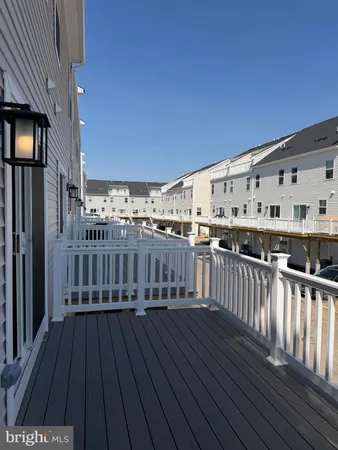 a view of a balcony with wooden floor