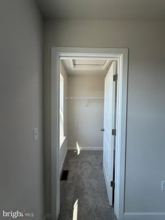 a bathroom with a shower sink and mirror