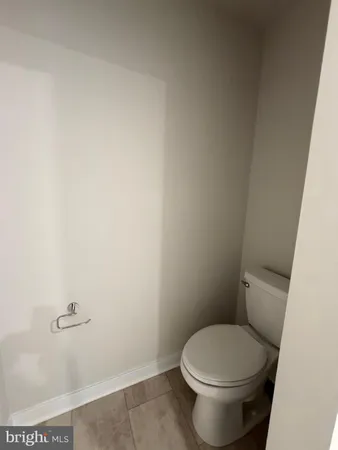 a bathroom with a shower sink vanity and mirror
